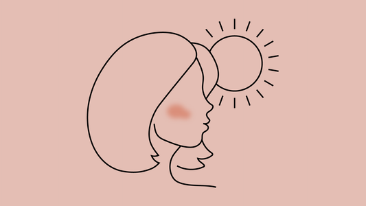 mujer al sol con mancha roja en el rostro