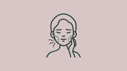 rostro_sobre_fondo_rosa_con_cara_de_dolor_y_mejillas_irritadas